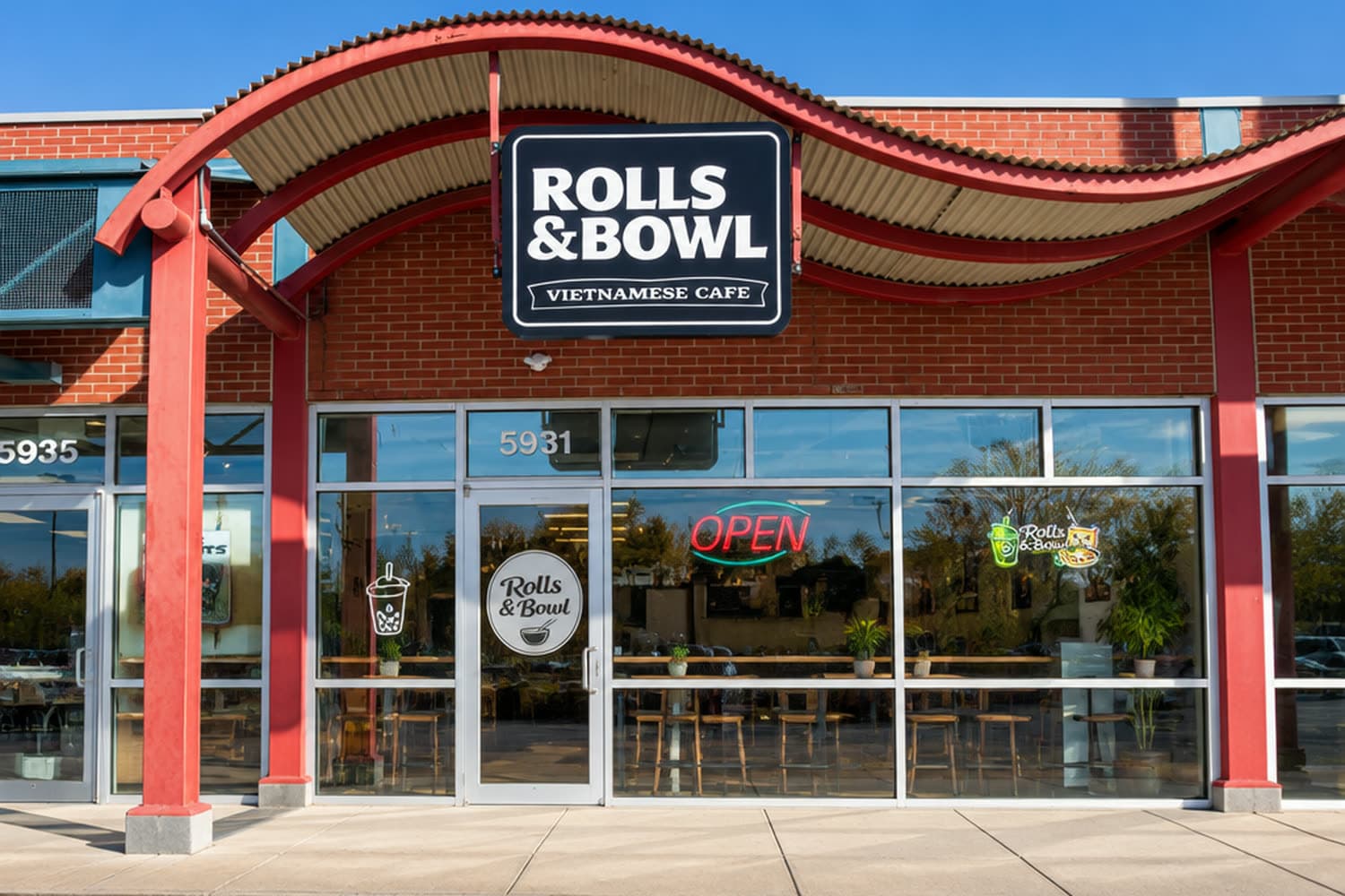 The Rolls & Bowl storefront on Ashworth Road, West Des Moines — the Vietnamese Café sign under the red awning
